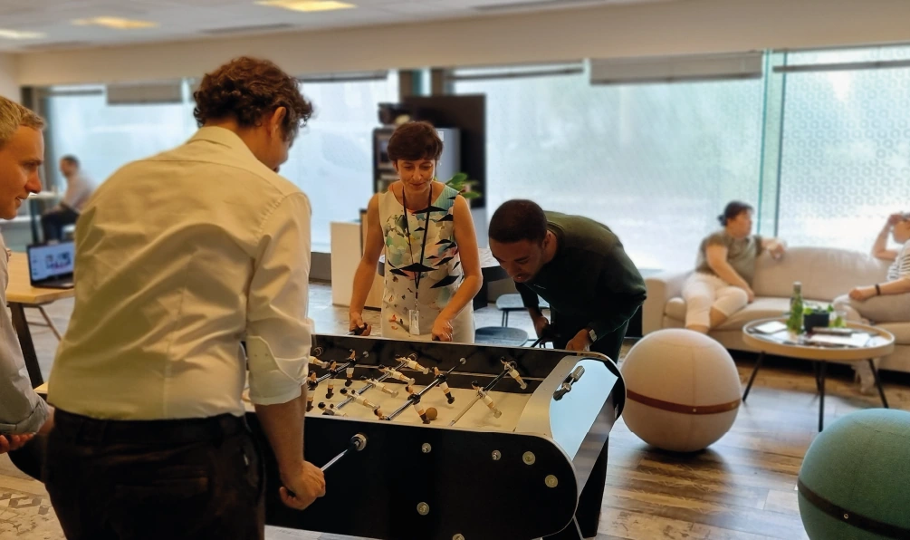 People playing table football in a cafeteria